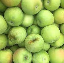 a pile of green apples
