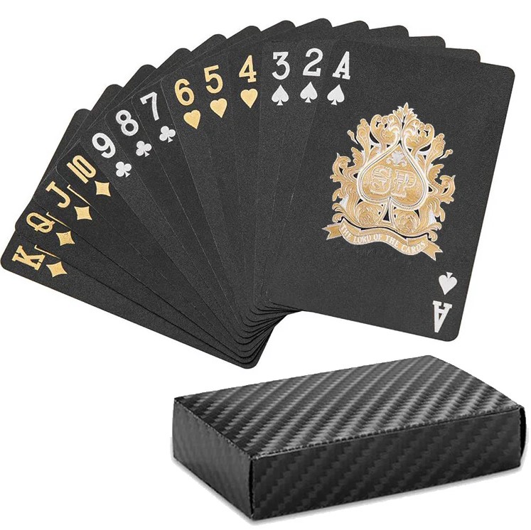 13 Black Playing cards from Ace to King with the playing card box laid on a white background