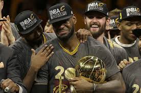 LeBron James crying and holding the championship trophy after leading the Cleveland Cavaliers to their first NBA Championship in franchise history