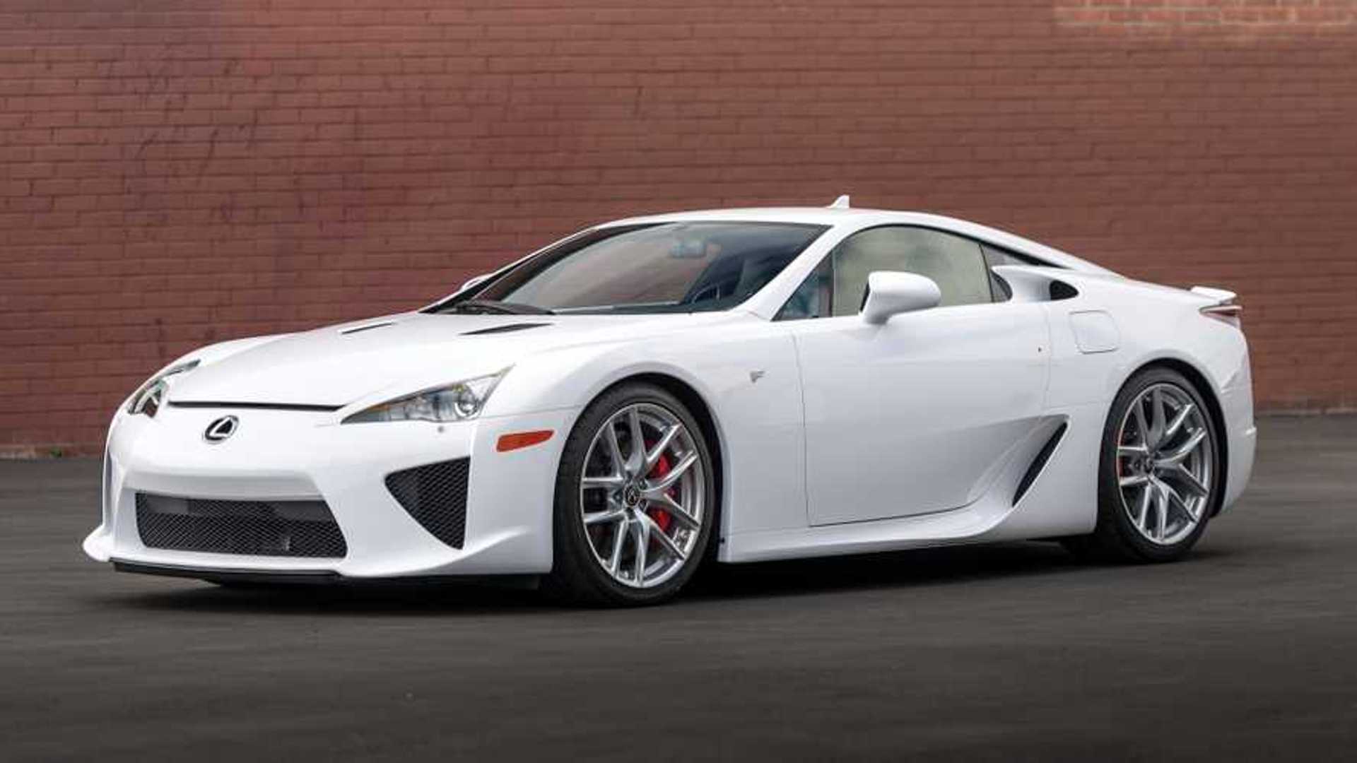 A picture of the Lexus LFA supercar parked next to a brick wall