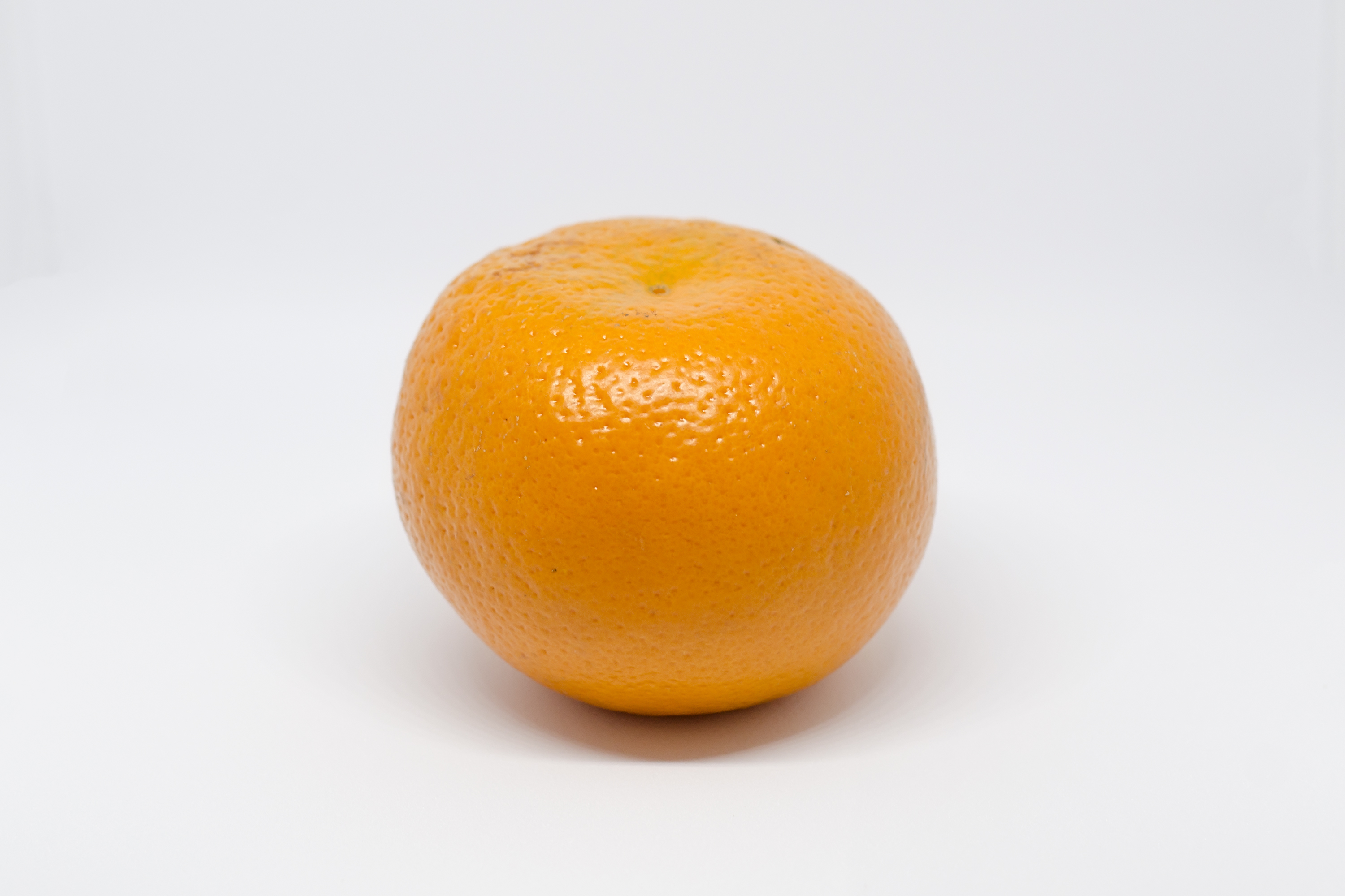 A single orange: a citrus fruit that is a rich source of vitamin C