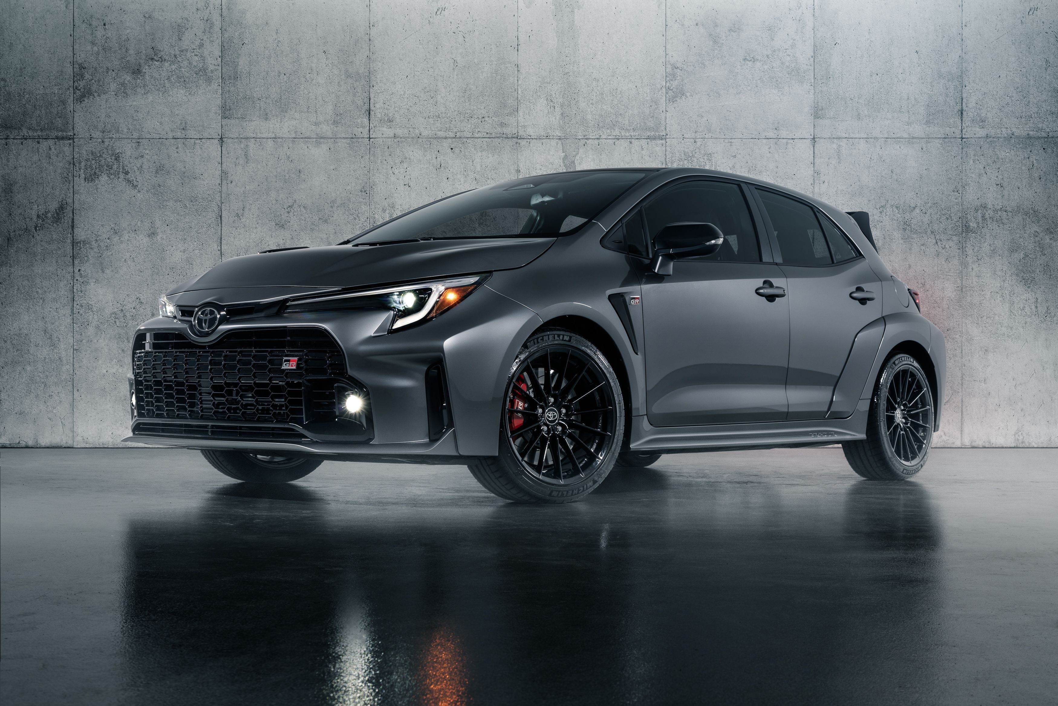 An image of a Toyota Corolla parked in a concrete cube